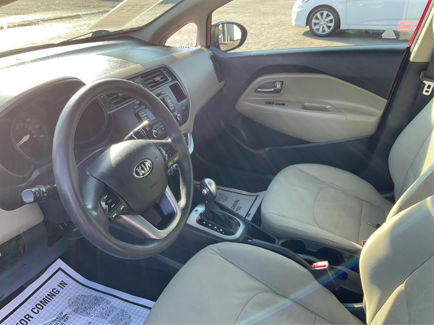 2014 Signal Red /Black/ Tan Kia Rio LX (KNADM4A31E6) with an 1.6L I-4 gasoline direct injection engine, located at 1865 W 2nd St., Xenia, OH, 45385, (937) 372-7777, 39.681259, -83.961945 - Photo#8