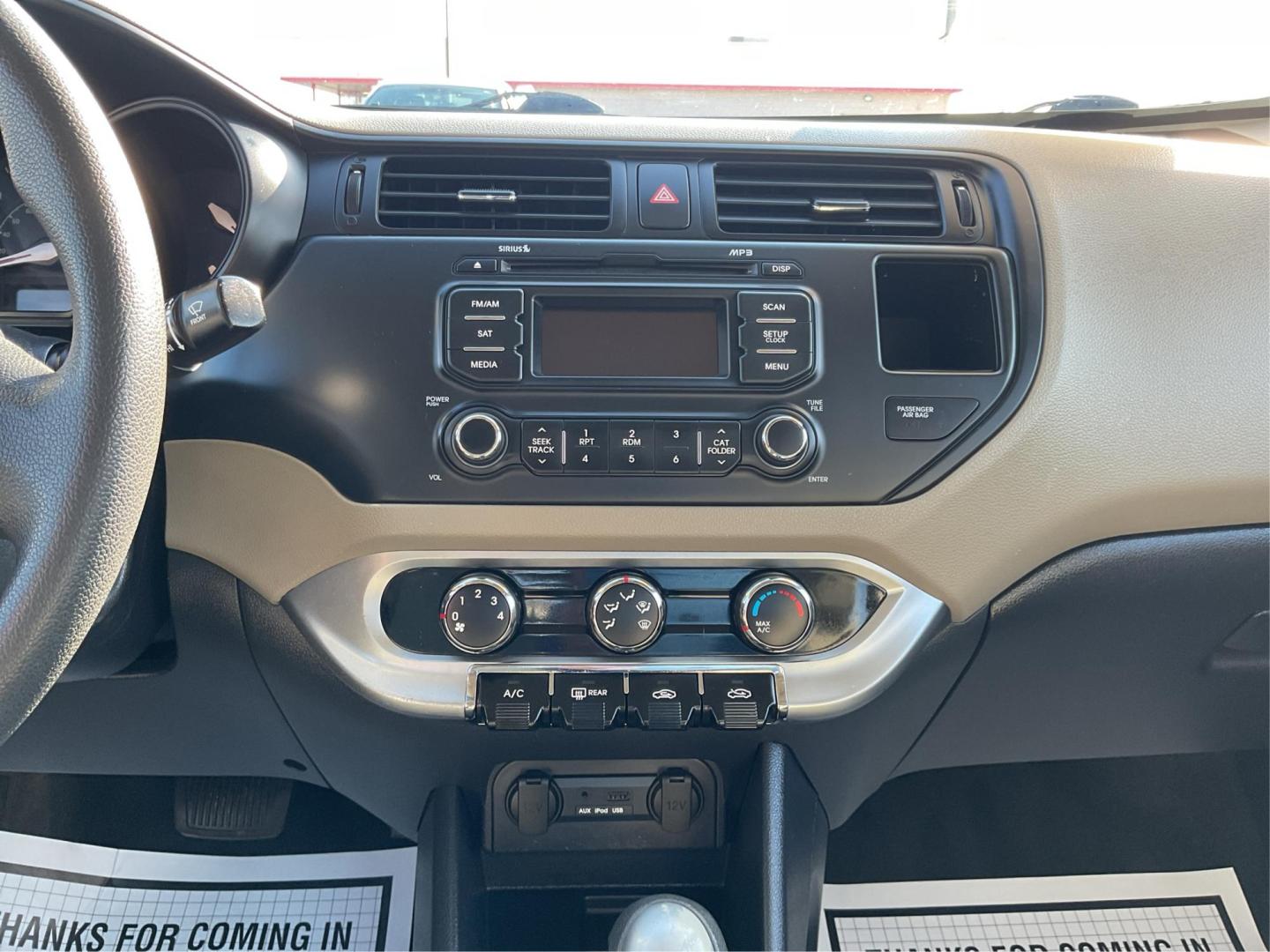 2014 Signal Red /Black/ Tan Kia Rio LX (KNADM4A31E6) with an 1.6L I-4 gasoline direct injection engine, located at 1865 W 2nd St., Xenia, OH, 45385, (937) 372-7777, 39.681259, -83.961945 - Photo#12