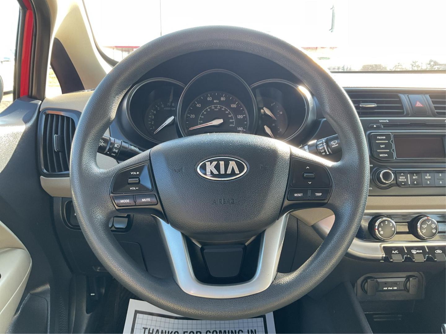 2014 Signal Red /Black/ Tan Kia Rio LX (KNADM4A31E6) with an 1.6L I-4 gasoline direct injection engine, located at 1865 W 2nd St., Xenia, OH, 45385, (937) 372-7777, 39.681259, -83.961945 - Photo#15