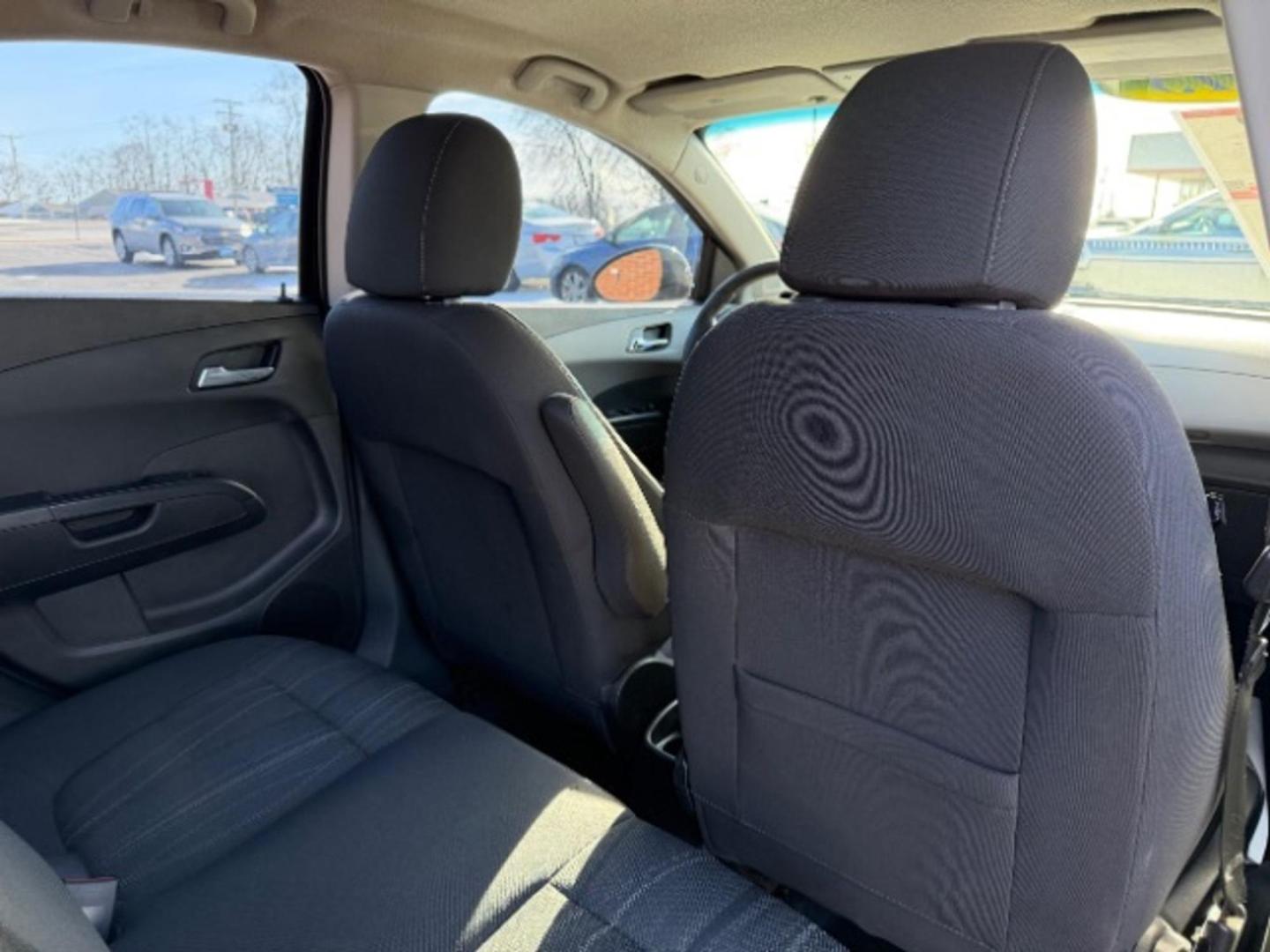 2013 Black Granite Metallic Chevrolet Sonic LT Auto Sedan (1G1JC5SB6D4) with an 1.4L L4 DOHC 24V TURBO engine, 6-Speed Automatic transmission, located at 1865 W 2nd St., Xenia, OH, 45385, (937) 372-7777, 39.681259, -83.961945 - Photo#10