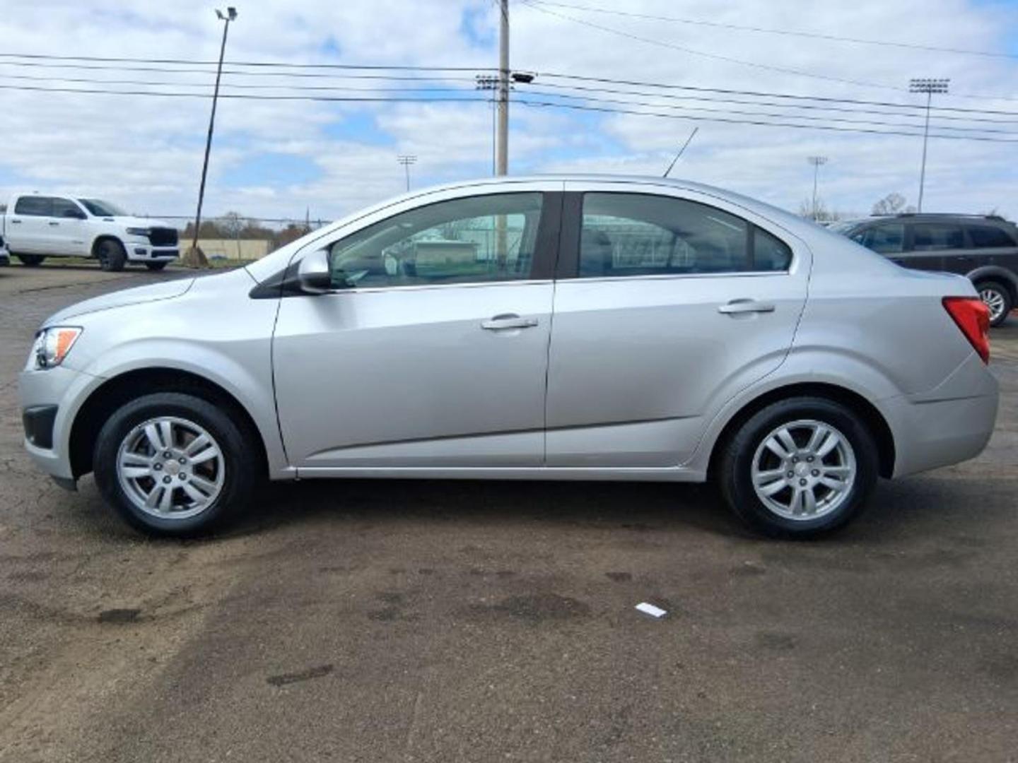 2015 Silver Ice Metallic Chevrolet Sonic LT Auto (1G1JC5SG7F4) with an ECOTEC 1.4L I-4 DOHC engine, located at 1865 W 2nd St., Xenia, OH, 45385, (937) 372-7777, 39.681259, -83.961945 - Photo#2