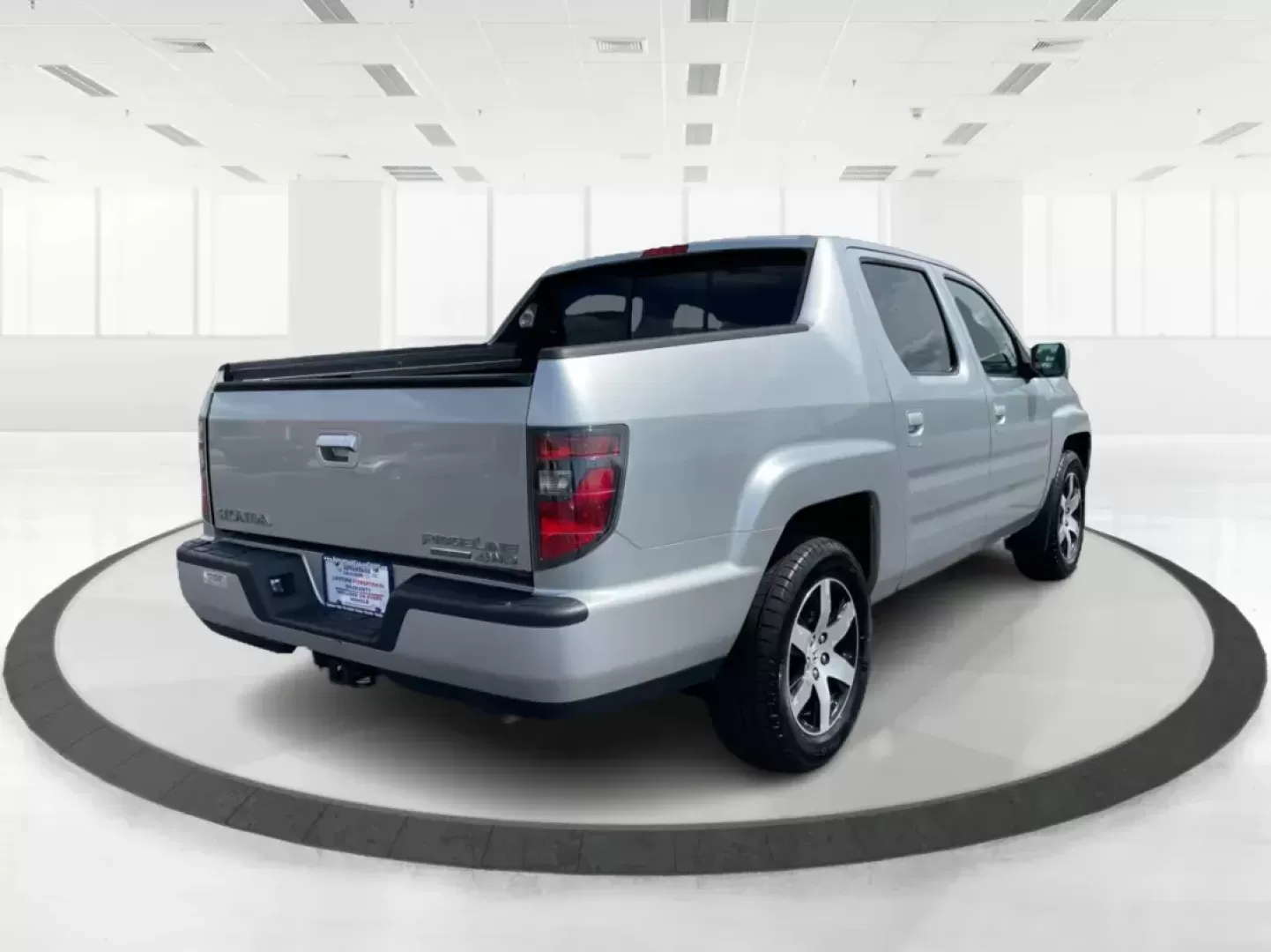 2014 Honda Ridgeline RTL-S (5FPYK1F67EB) with an 3.5L V6 SOHC 24V engine, 5-Speed Automatic transmission, located at 1865 W 2nd St., Xenia, OH, 45385, (937) 372-7777, 39.681259, -83.961945 - 2014 Honda Ridgeline RTL-S - Photo#2
